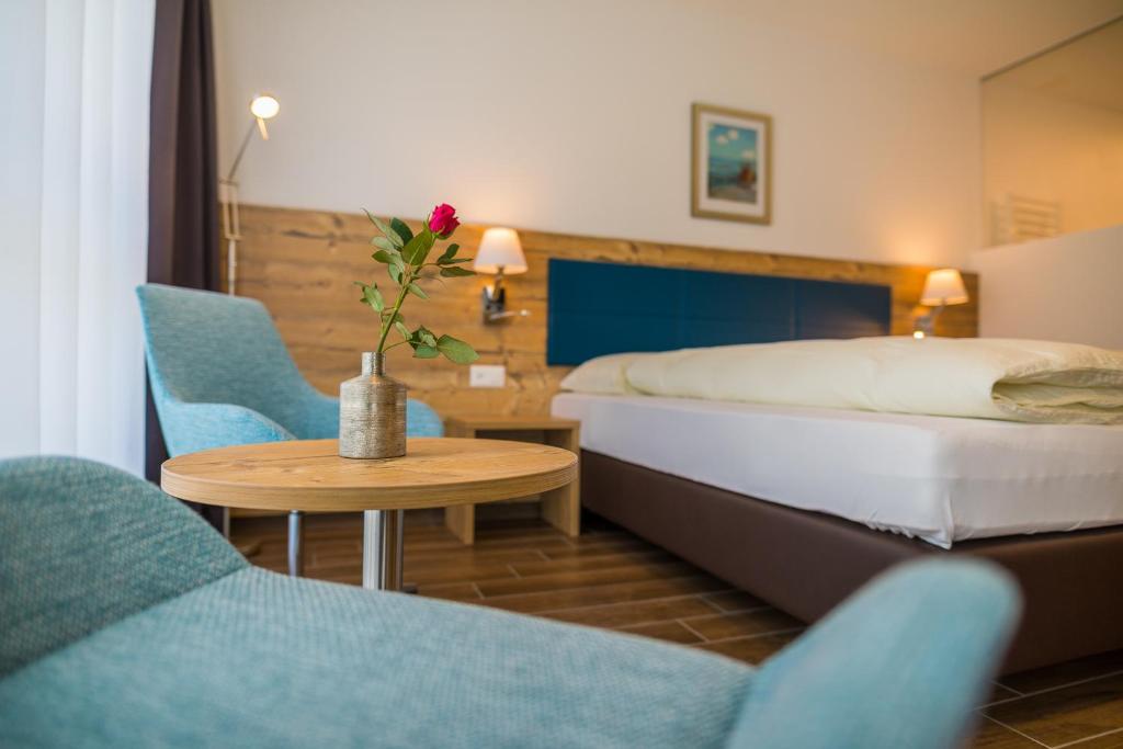Postel nebo postele na pokoji v ubytování Hotel Blattnerhof
