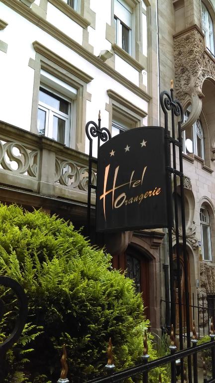 a sign for a hotel in front of a building at Hotel de l&#39;Orangerie in Strasbourg