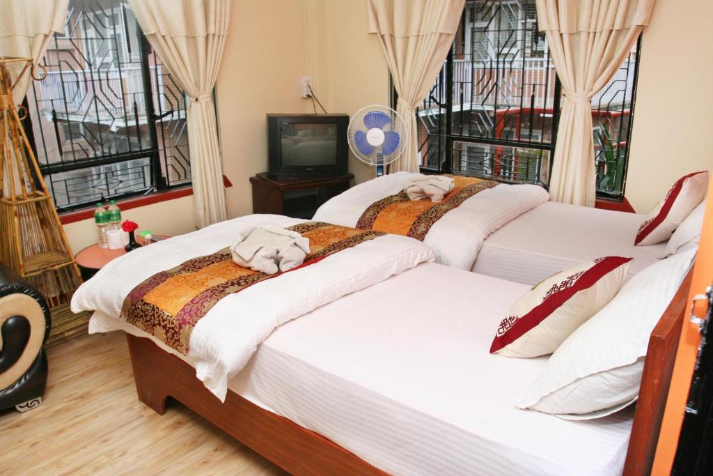 Postel nebo postele na pokoji v ubytování Thamel Backpackers Home