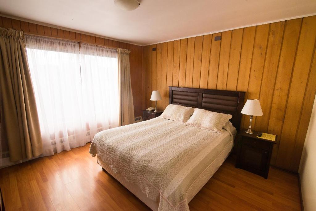 Postel nebo postele na pokoji v ubytování Hotel Terrazas del Lago