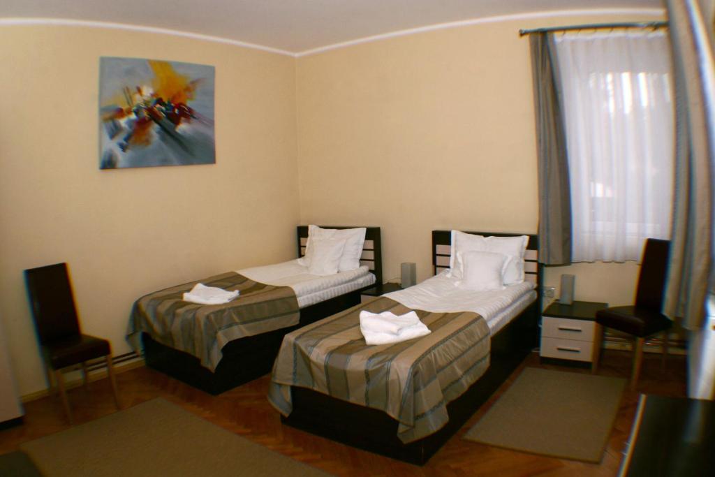 Postel nebo postele na pokoji v ubytování Vila Parc