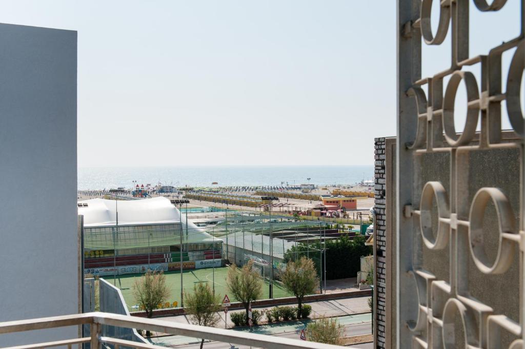 a view from the balcony of a building with a tennis court at Hotel Mediterraneo in Sottomarina