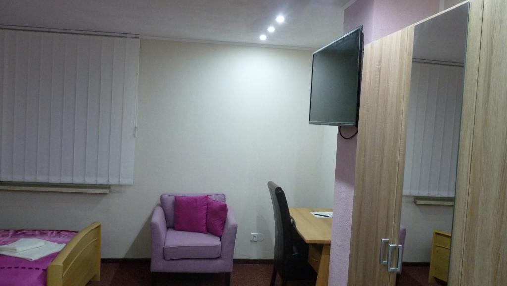 TV a/nebo společenská místnost v ubytování Hotel Rodizio UG