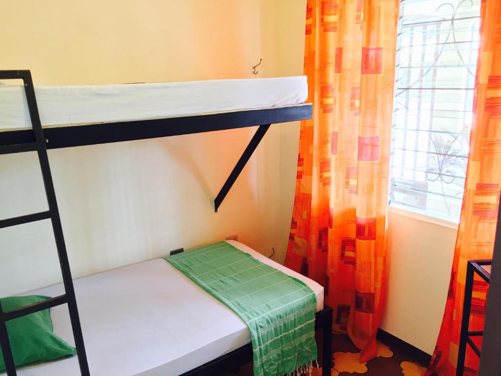 Postel nebo postele na pokoji v ubytování Hostel Dodero