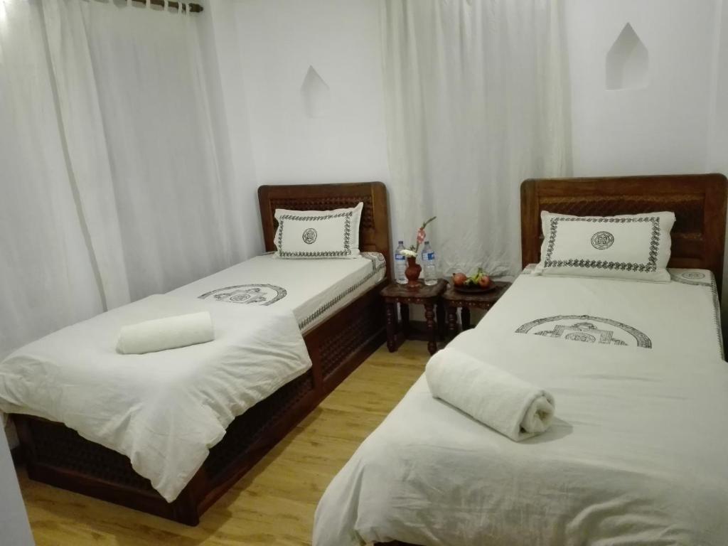 Postel nebo postele na pokoji v ubytování Sunny Guest House and Cafe
