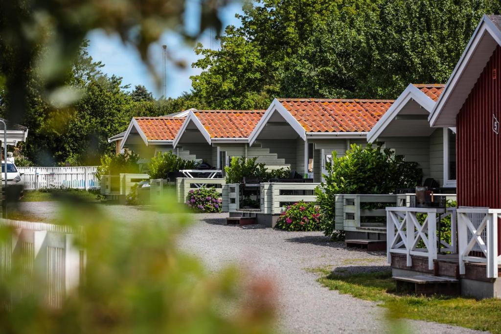 a row of houses with orange roofs at Hasle Camping & Hytter in Hasle