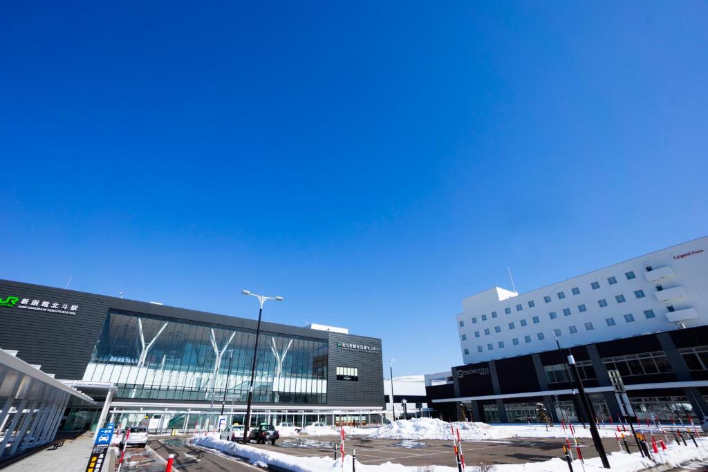 a group of buildings with snow on the ground at Hotel La'gent Plaza Hakodate Hokuto in Hokuto