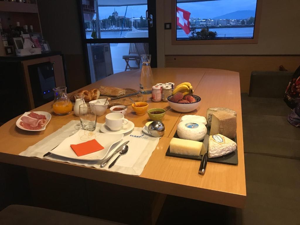 a table with some food on top of it at Floatinn Boat-BnB in Geneva