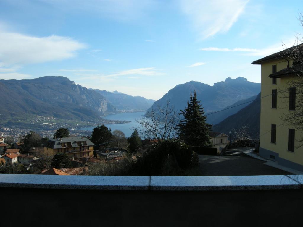 a view of a valley with a lake and mountains at Casa Pierini in Civenna