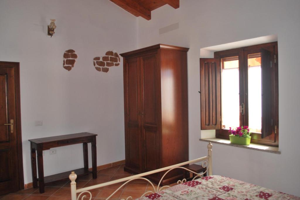 A bed or beds in a room at CASA VACANZE "SU PORTALE"