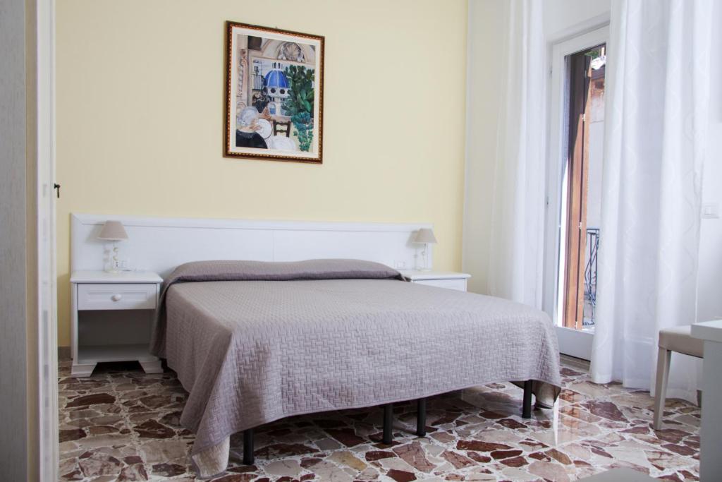 Postel nebo postele na pokoji v ubytování BFRAME Cornice Barocca