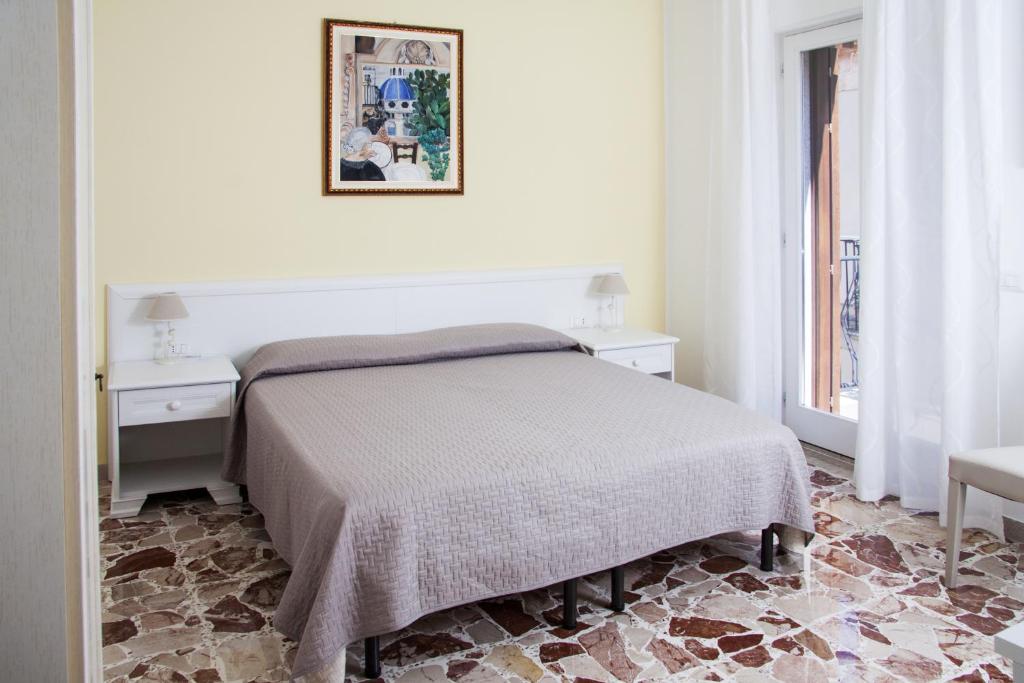 Postel nebo postele na pokoji v ubytování BFRAME Cornice Barocca