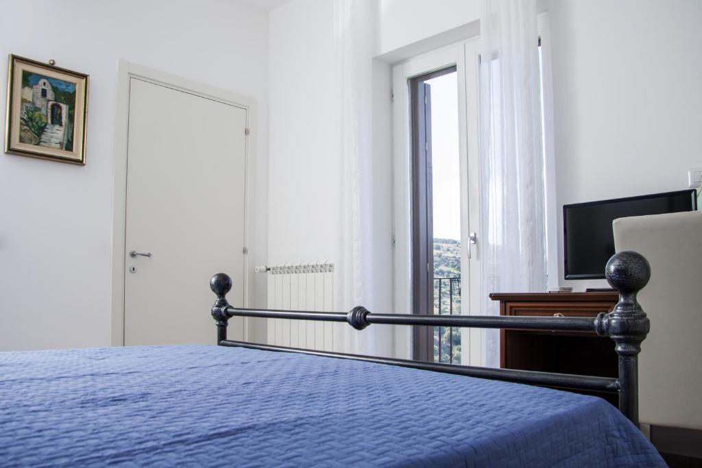 Postel nebo postele na pokoji v ubytování BFRAME Cornice Barocca