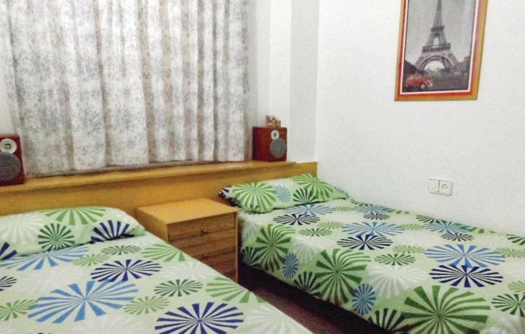 Posteľ alebo postele v izbe v ubytovaní Apartamento Edificio Diamant