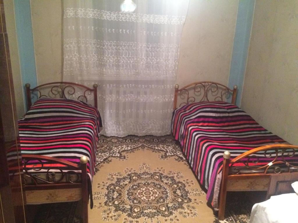 Postel nebo postele na pokoji v ubytování Serik & Geora Guesthouse