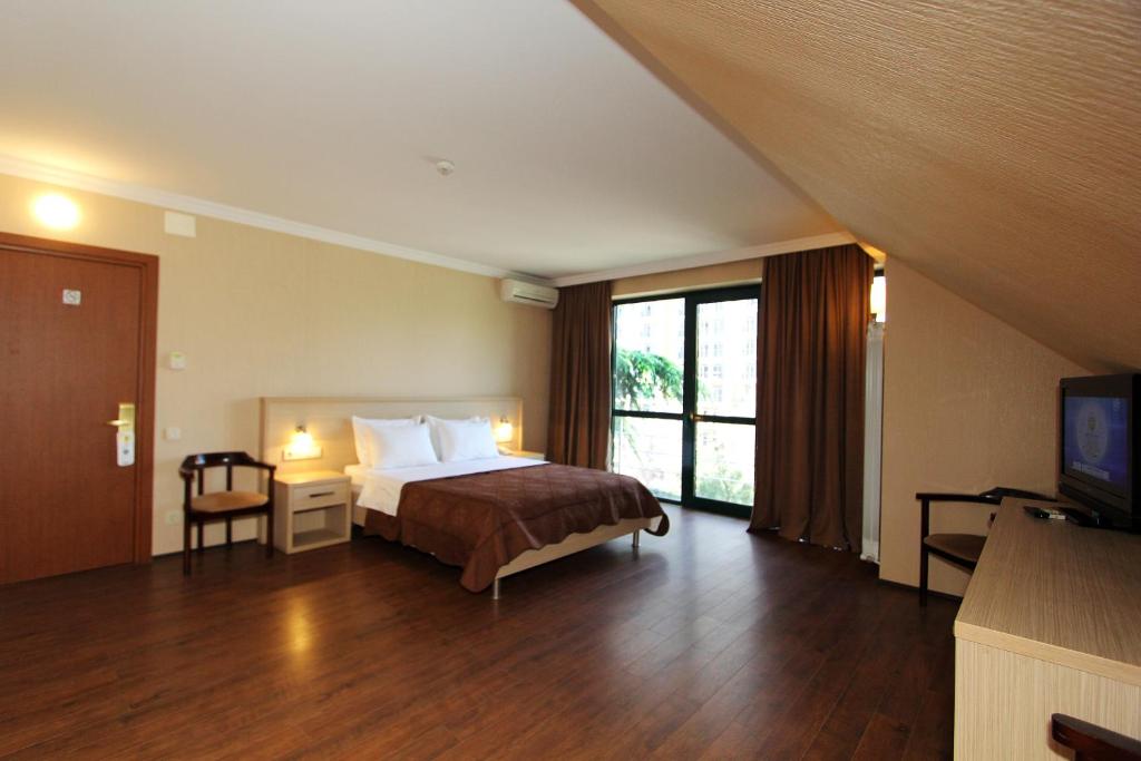 Postel nebo postele na pokoji v ubytování Batesta Hotel