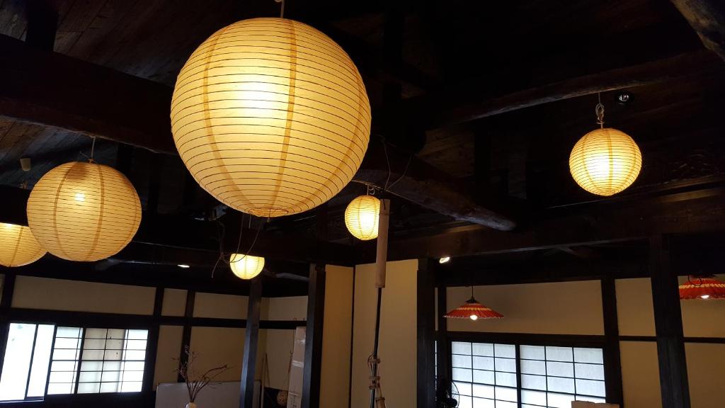 a group of lights hanging from the ceiling at Tawaraya Ryokan Koto Shirasagikan in Usuki