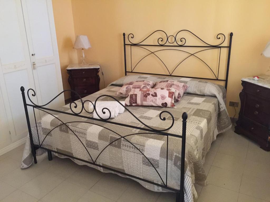 Postel nebo postele na pokoji v ubytování Villa Priscilla