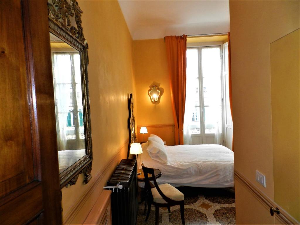 Postel nebo postele na pokoji v ubytování Bigo Guest House