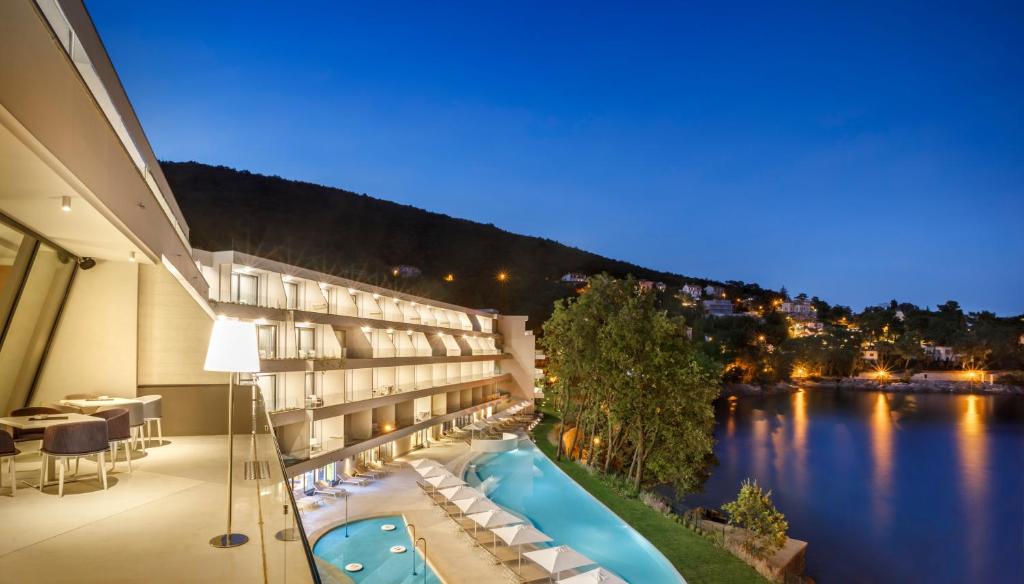 a view of a hotel with a swimming pool at Hotel Ičići - Liburnia in Opatija