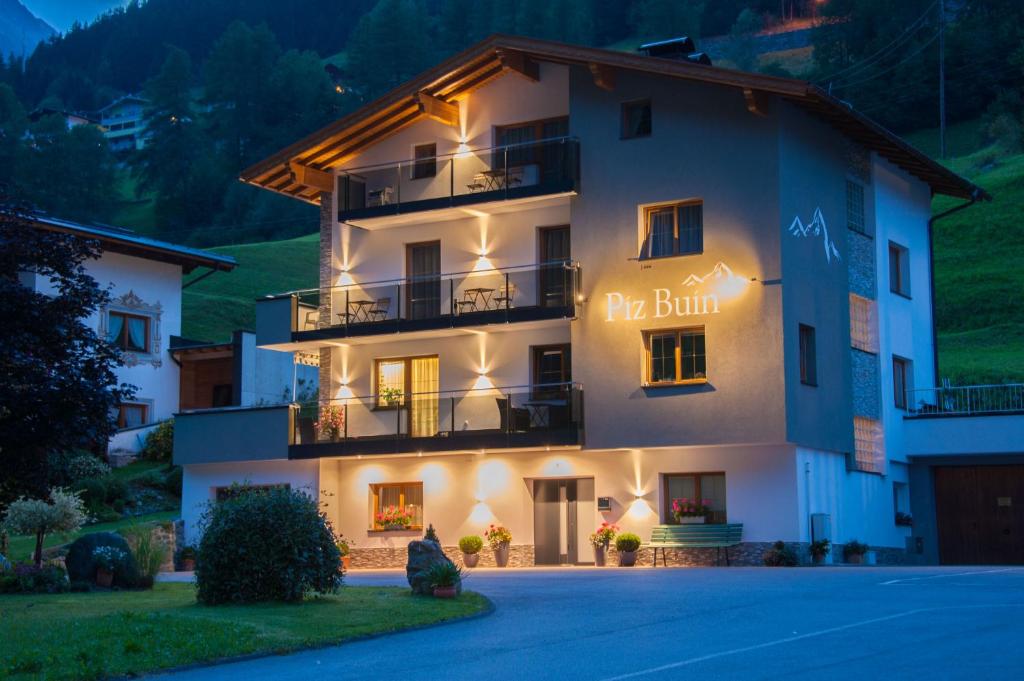 a building with a sign that reads the built at Piz Buin in Kappl