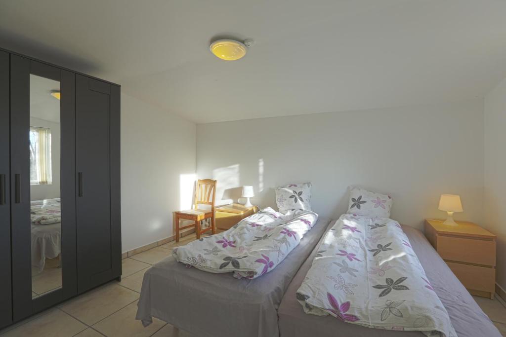 Postel nebo postele na pokoji v ubytování Strandens Apartment