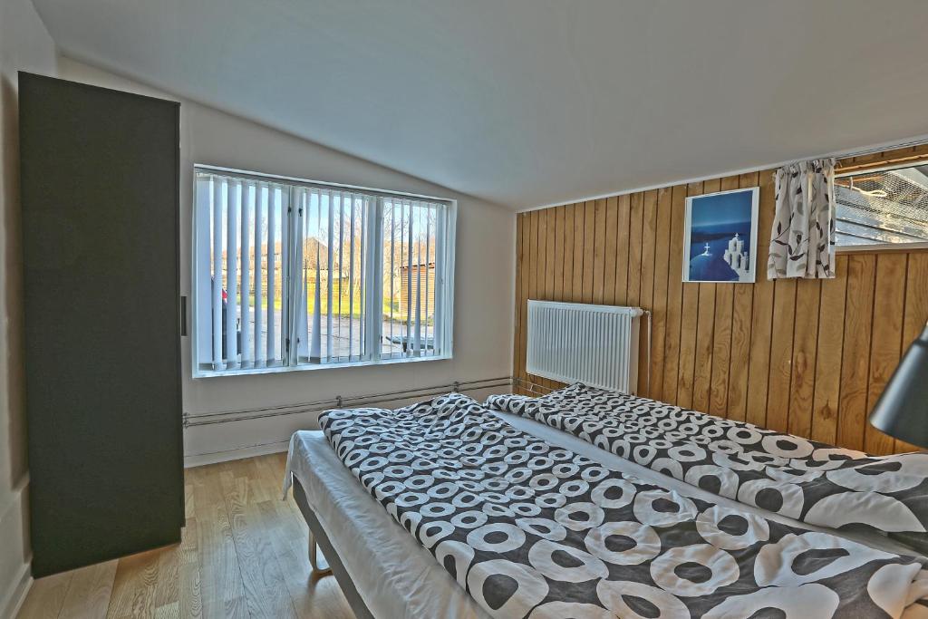 Postel nebo postele na pokoji v ubytování Strandens Apartment