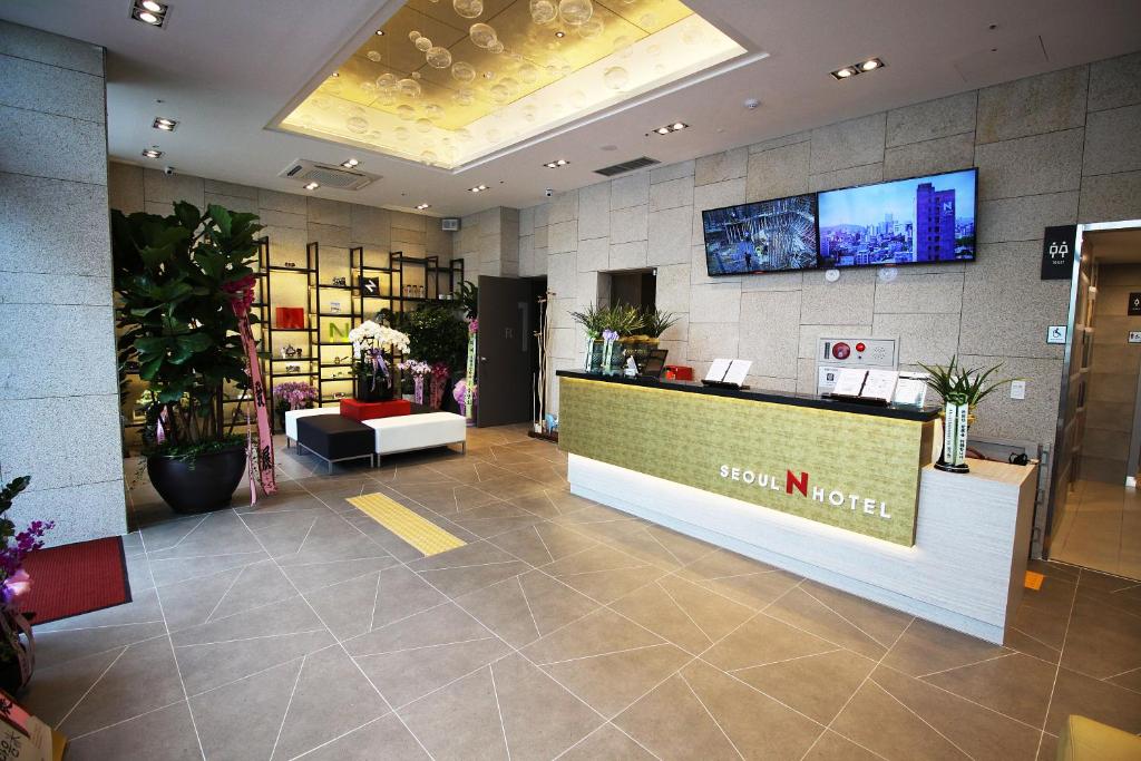 a lobby of a flower shop with a reception desk at Seoul N Guesthouse Dongdaemoon in Seoul