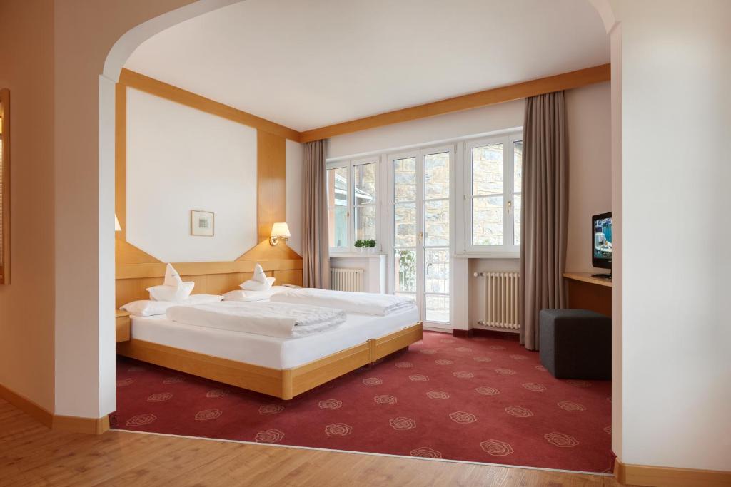Postel nebo postele na pokoji v ubytování Hotel Goldene Rose