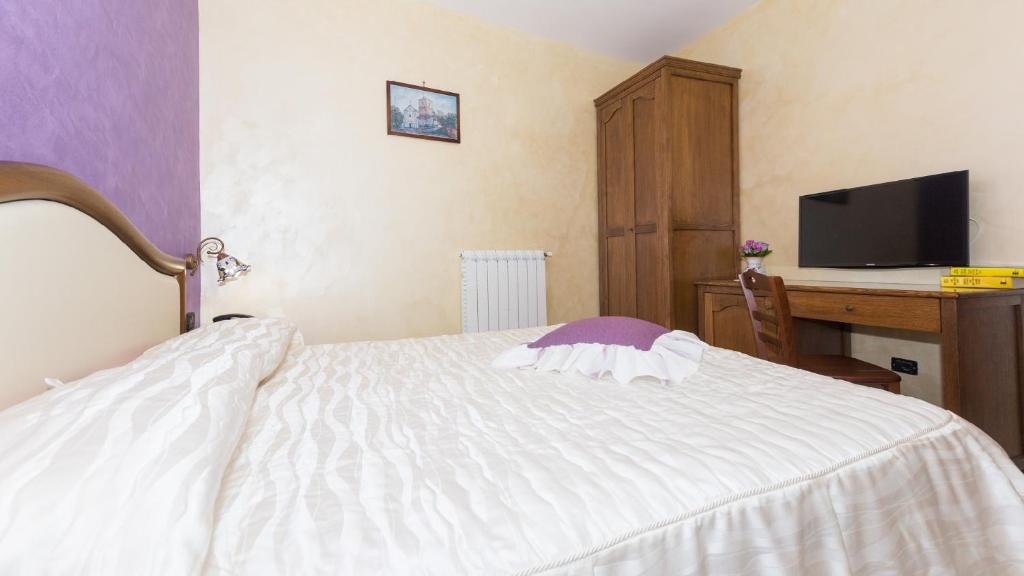 Postel nebo postele na pokoji v ubytování B&B Fior Tramonti