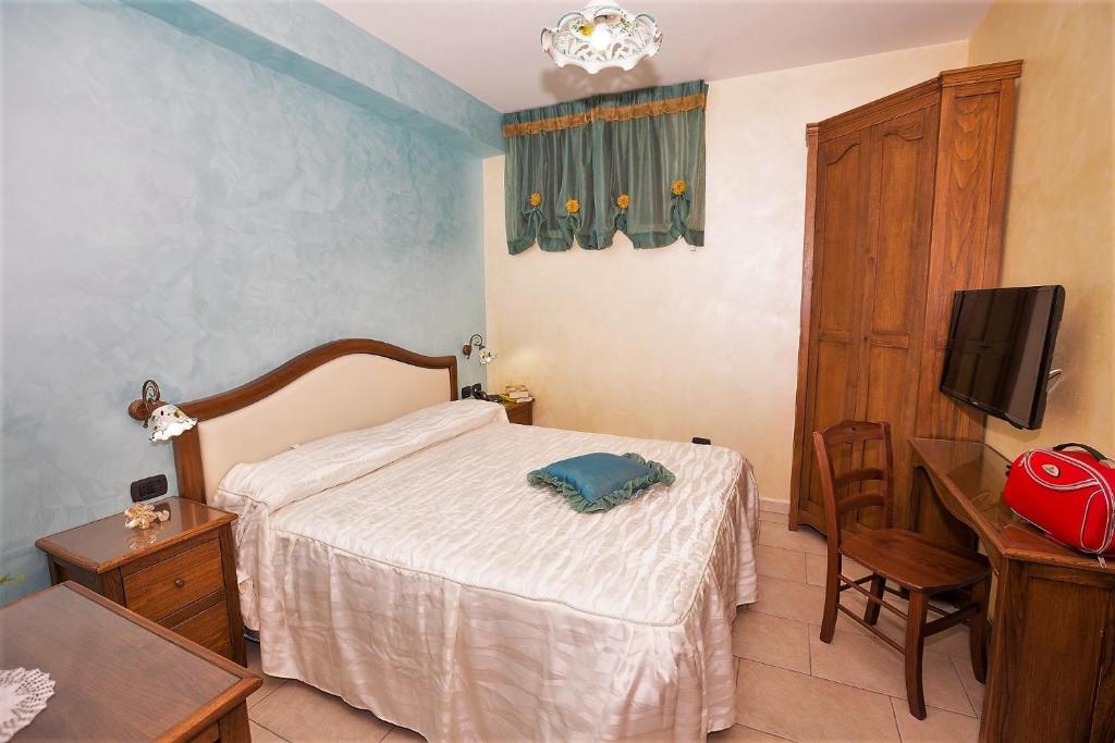Postel nebo postele na pokoji v ubytování B&B Fior Tramonti
