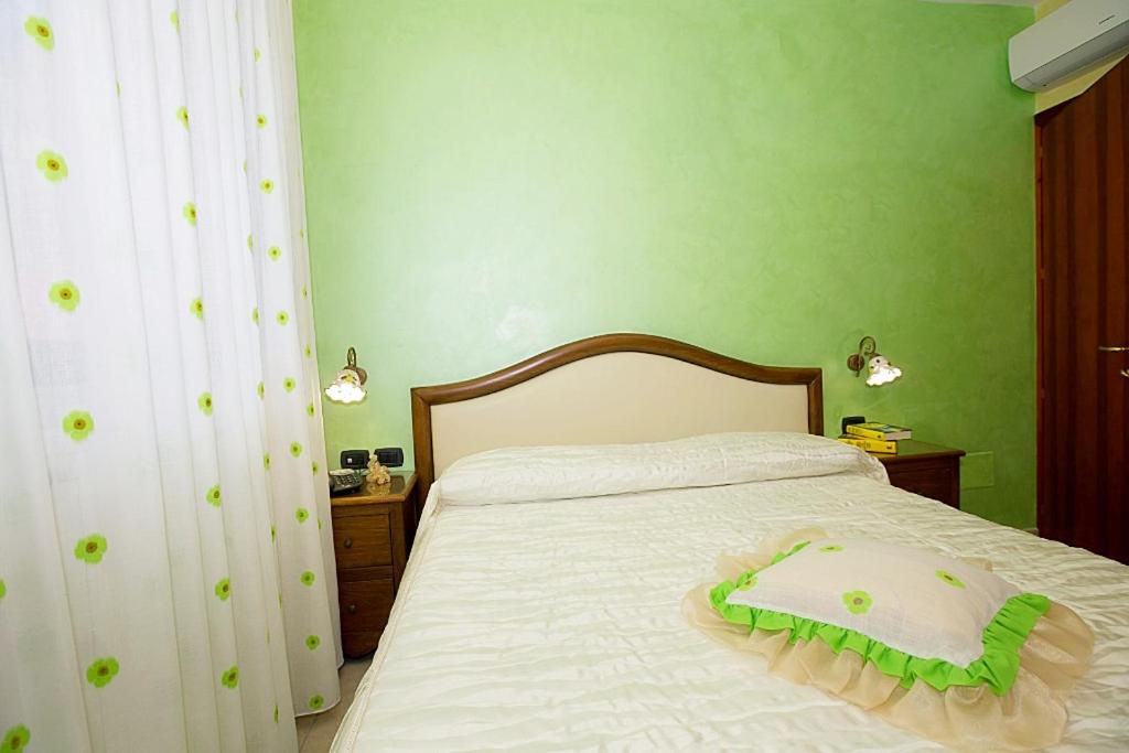 Postel nebo postele na pokoji v ubytování B&B Fior Tramonti