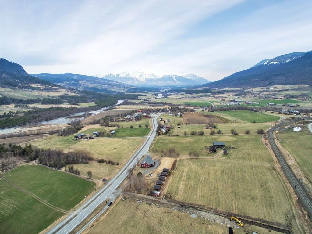 an aerial view of a road with mountains in the background at Driva Hytter in Oppdal