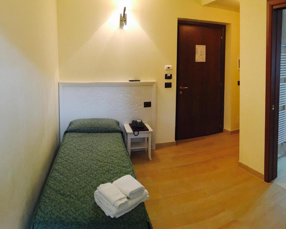 Postel nebo postele na pokoji v ubytování Hotel San Berardo