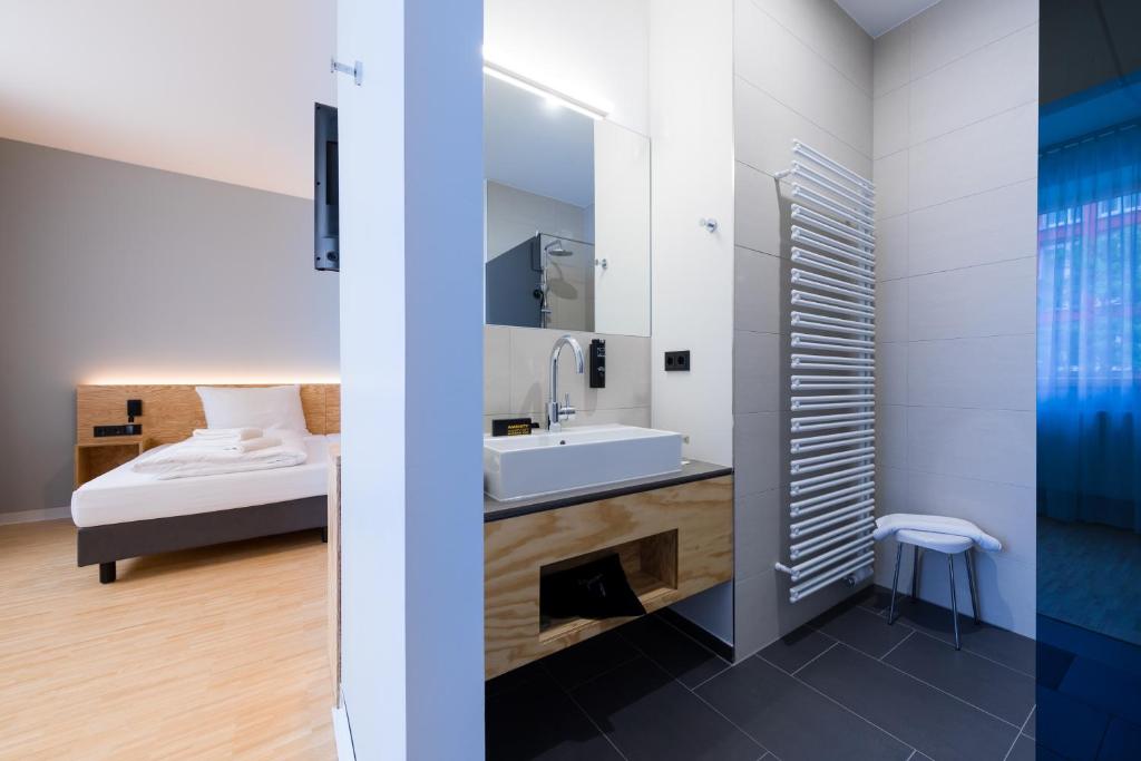 Postel nebo postele na pokoji v ubytování mk | hotel münchen city