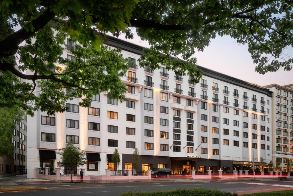a large white building on a city street at The Darcy Hotel, Washington DC in Washington