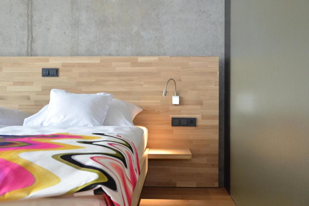 Voodi või voodid majutusasutuse Hotel de l'Ecluse Superior toas