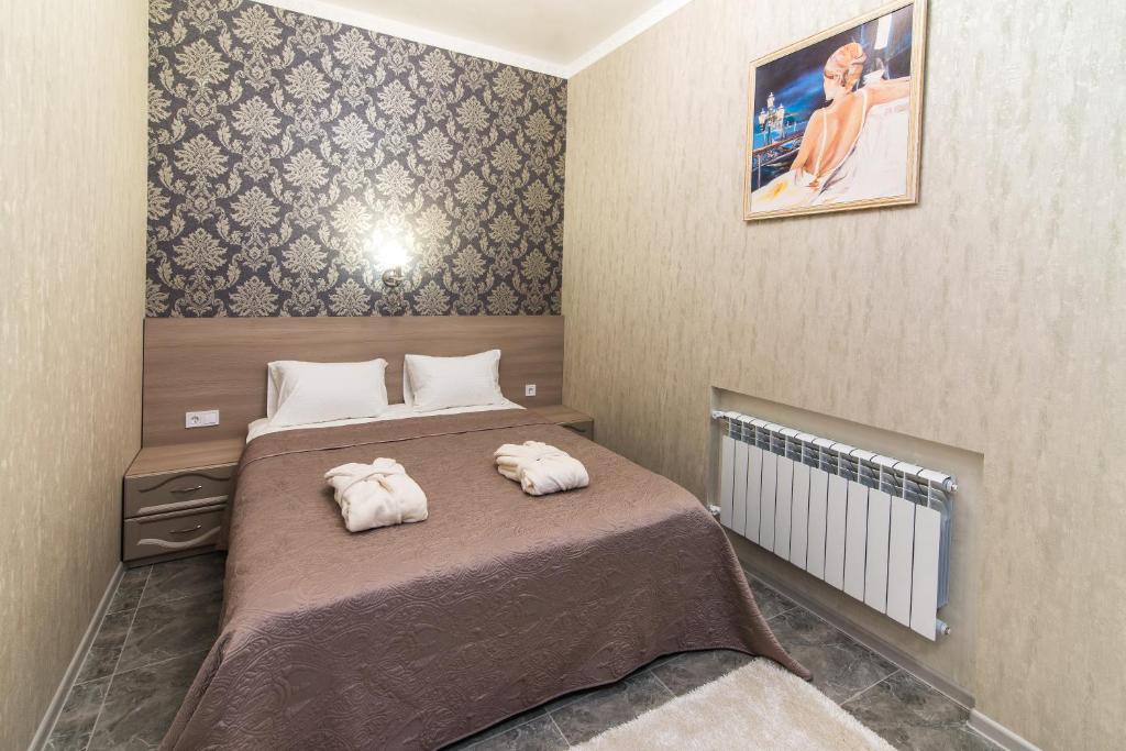 Postel nebo postele na pokoji v ubytování L.O.Y Family Hotel
