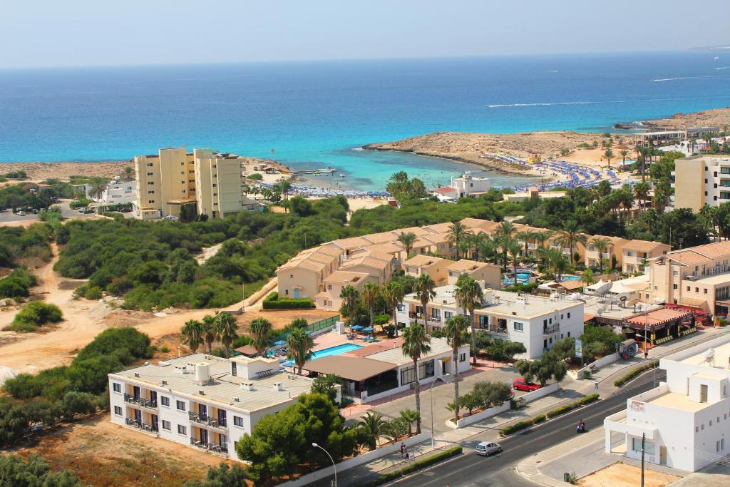 an aerial view of a city and the ocean at Carina Hotel Apartments in Ayia Napa