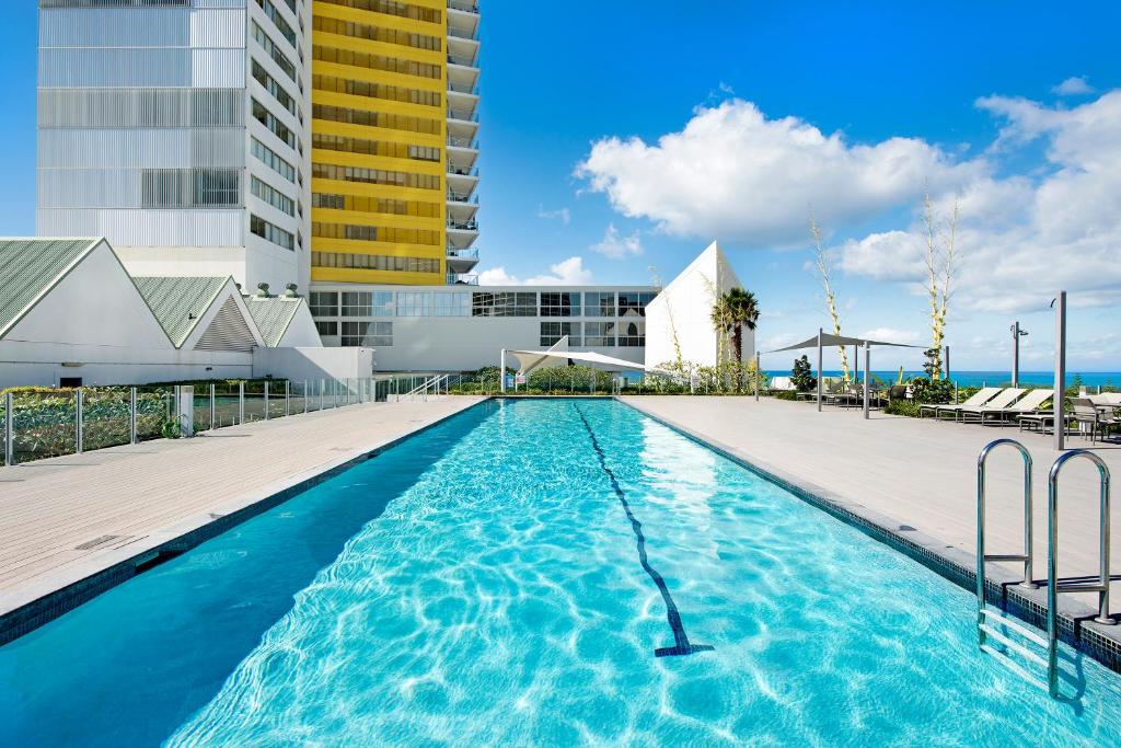 a swimming pool on top of a building at ULTIQA Air On Broadbeach in Gold Coast