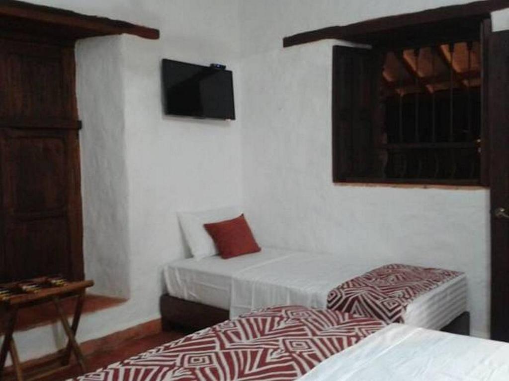 Postel nebo postele na pokoji v ubytování La Loma Hotel Barichara