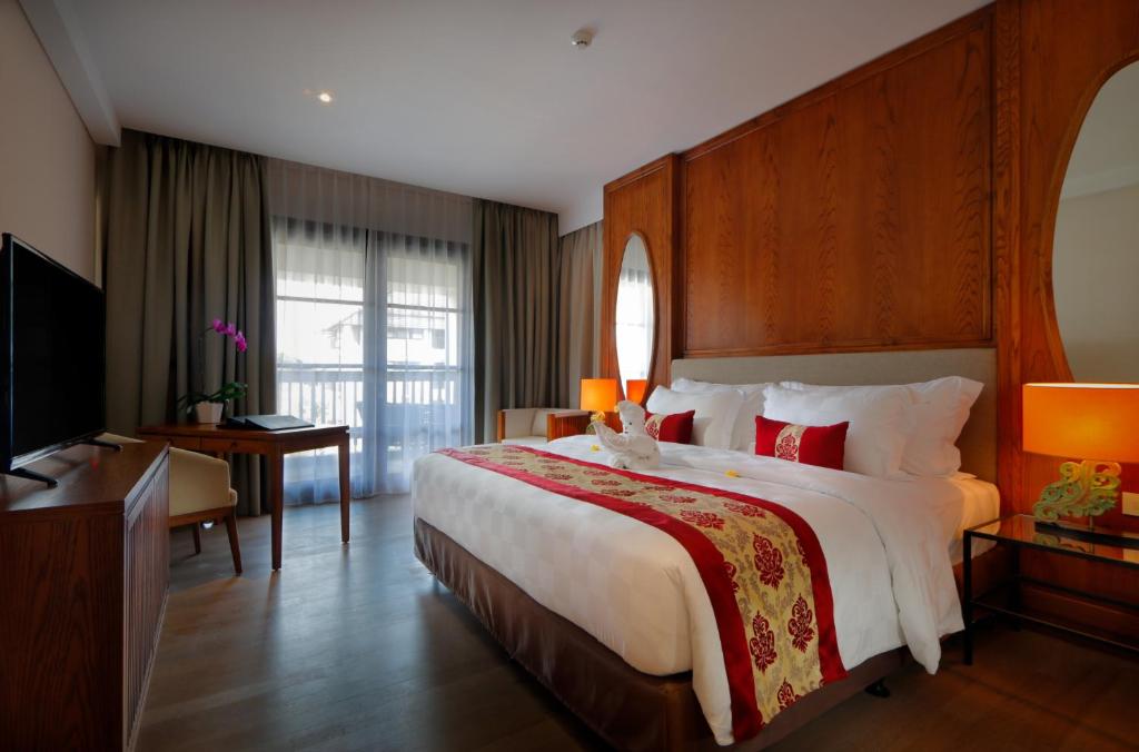 Postel nebo postele na pokoji v ubytování Royal Tulip Springhill Resort Jimbaran