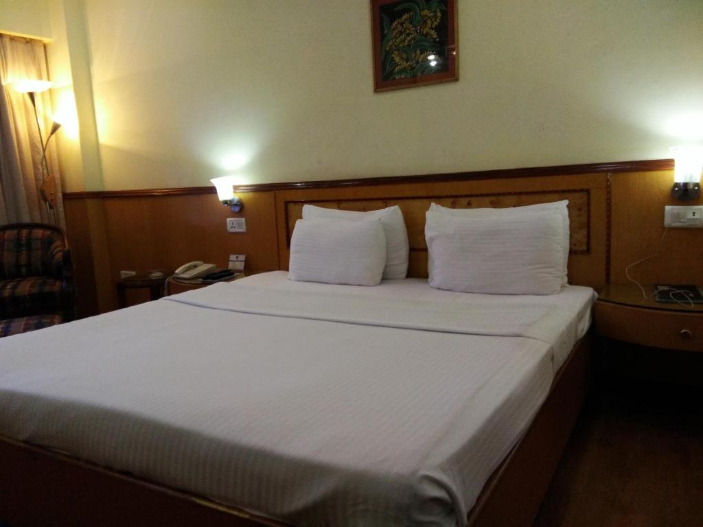 Postel nebo postele na pokoji v ubytování Hotel Empires