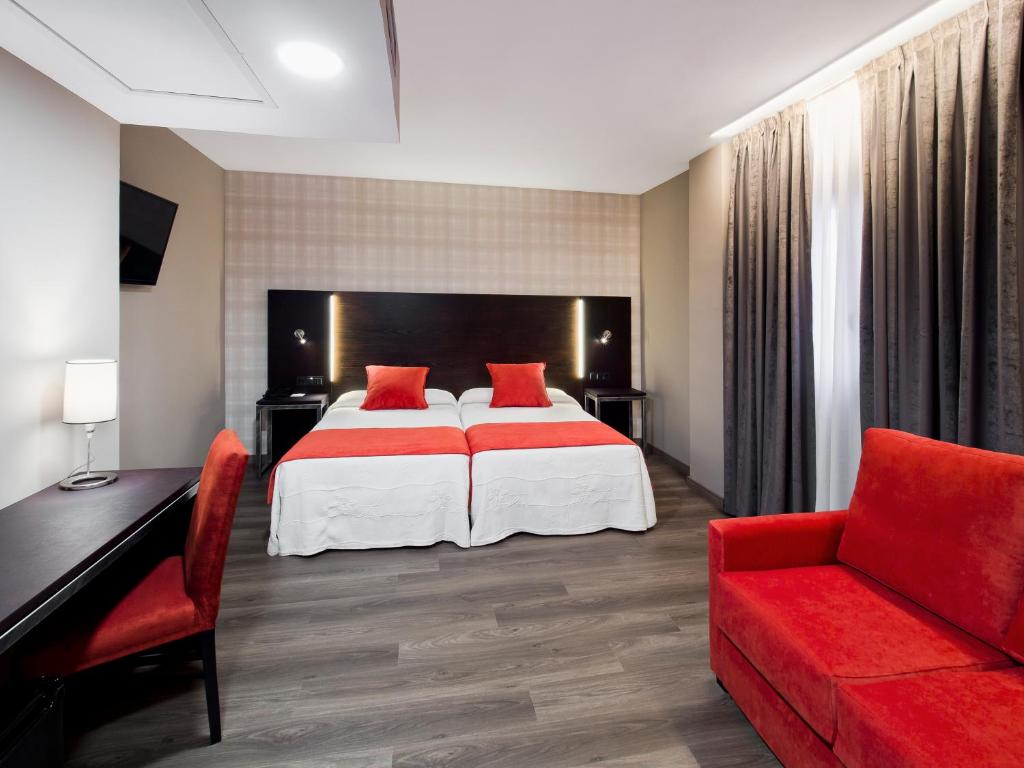 Postel nebo postele na pokoji v ubytování Hotel Zentral Parque