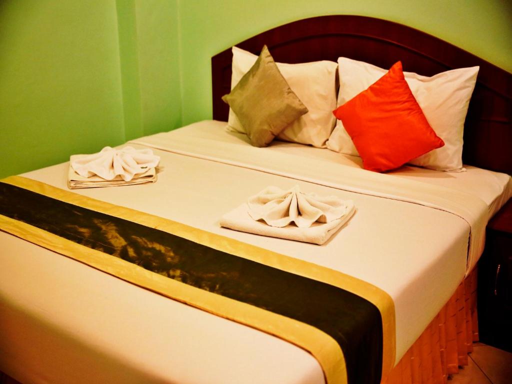 Säng eller sängar i ett rum på Baan SS Karon