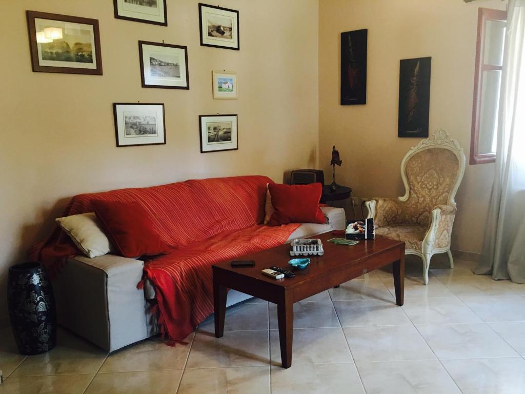 a living room with a couch and a table at Kasteli House in Spetses