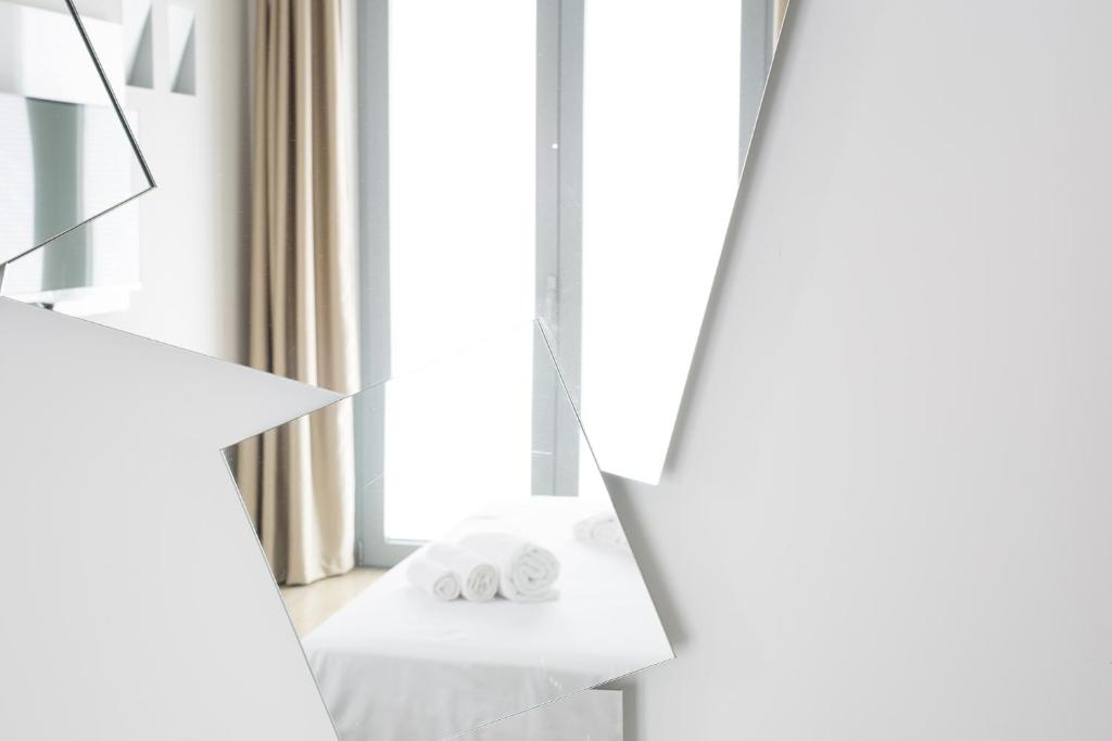 Postel nebo postele na pokoji v ubytování Hotel Al Veliero