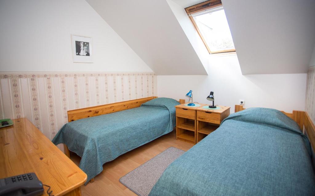 Voodi või voodid majutusasutuse Katariina Guesthouse toas