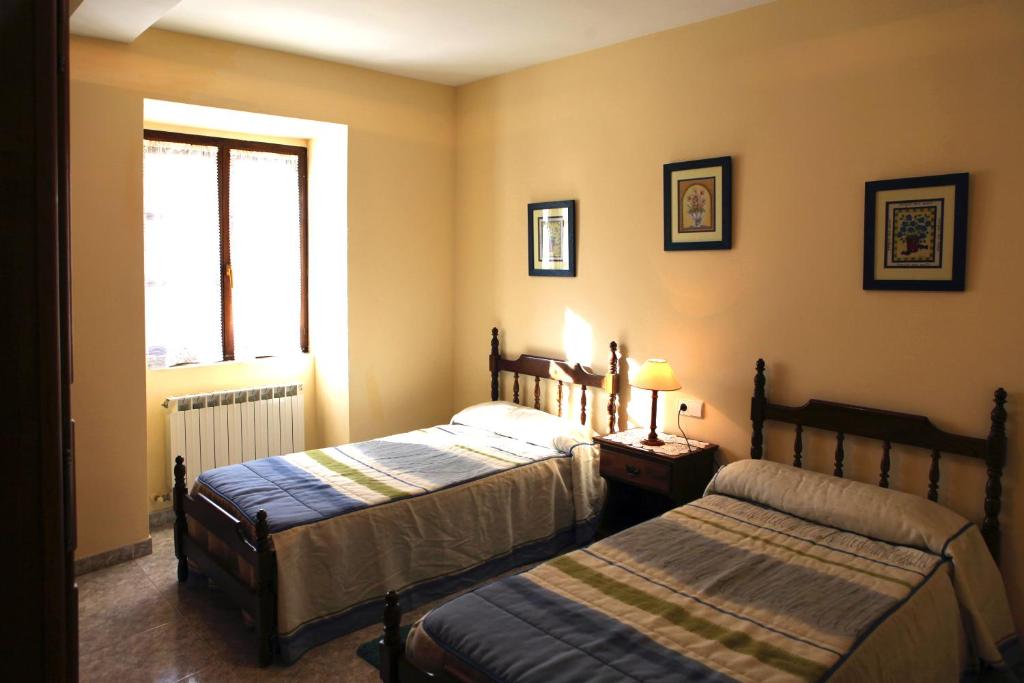 A bed or beds in a room at Casa Rural Bordaberea