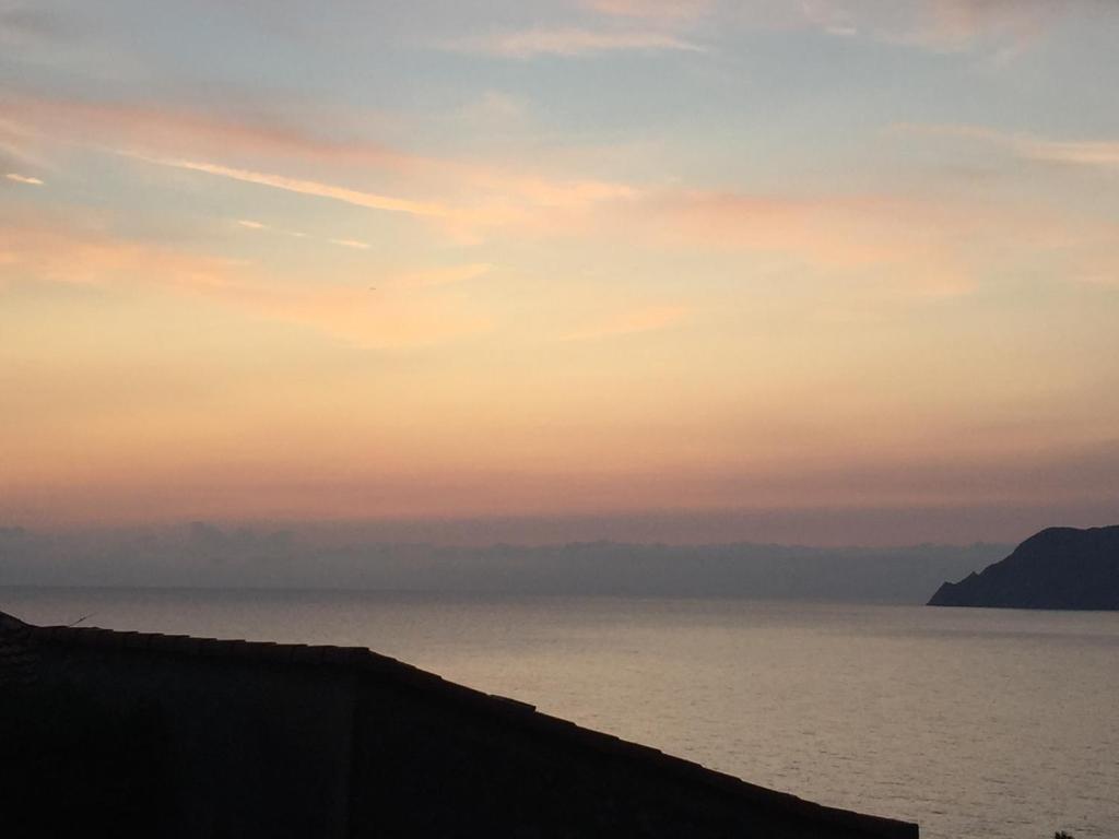 a view of the ocean at sunset at Le Storie di Manarola in Manarola